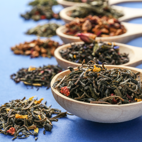 Photo of wooden spoons containing different tea blends