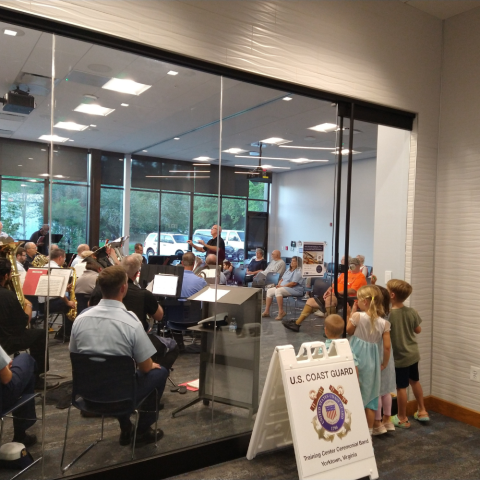 Photo of USCG TRACEN Yorktown Band playing in the Yorktown meeting room