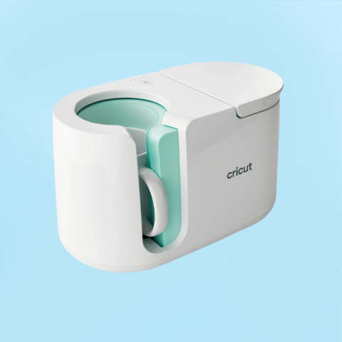 Photo of a cricut mug press against a blue background